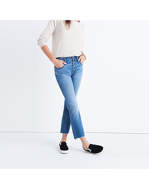 madewell cali demi-boot jeans worn with mockneck pullover sweater.