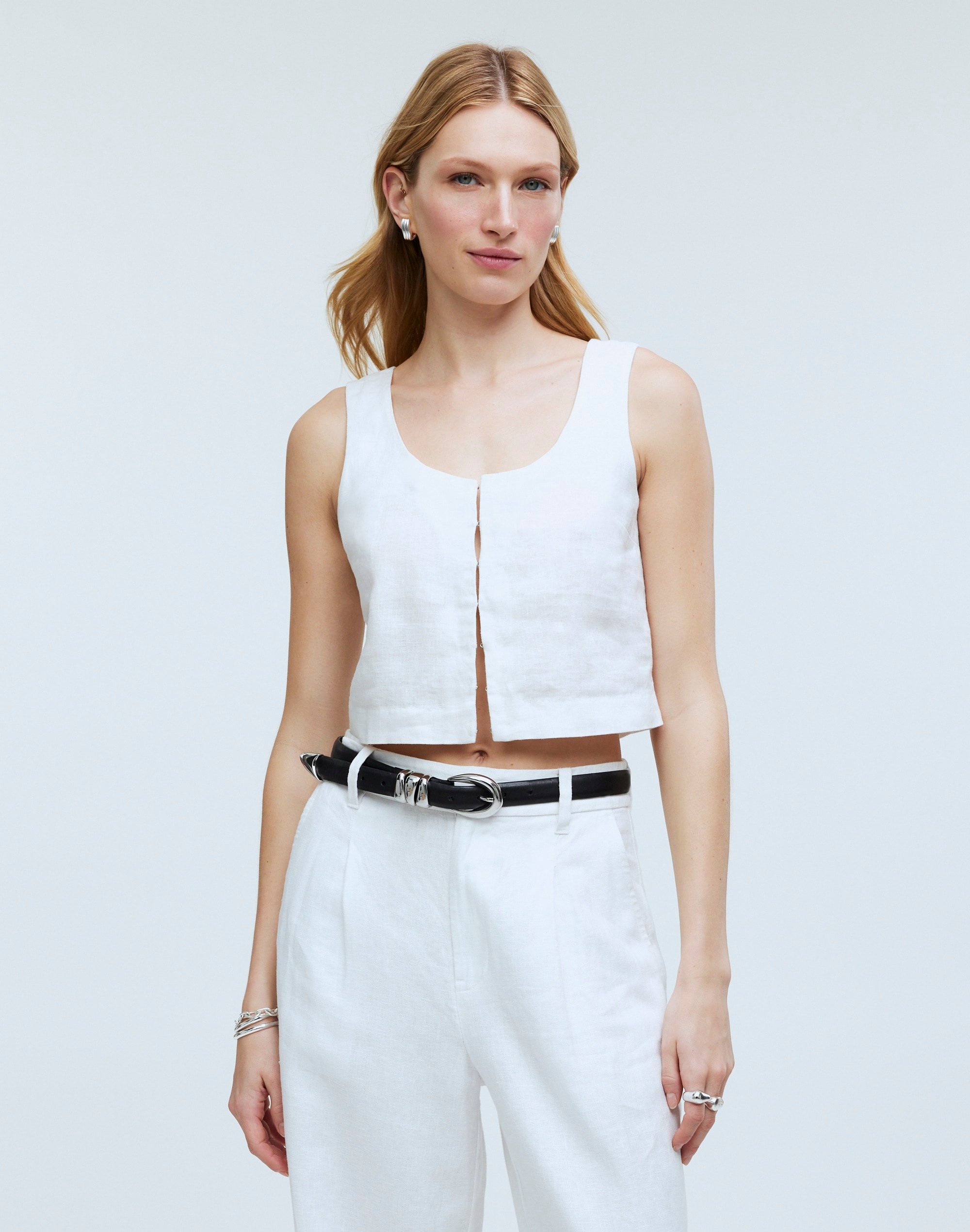 A Woman Wearing White Shorts Black Leather Tank Top · Free Stock Photo